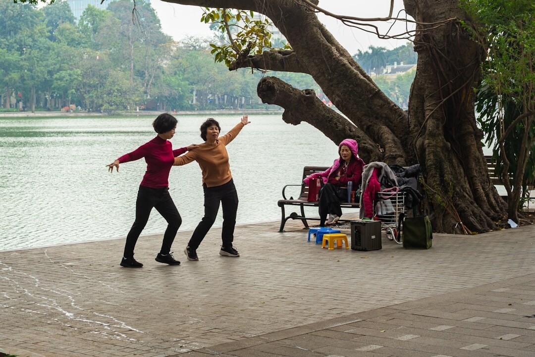 seniors doing gentle exercise in park