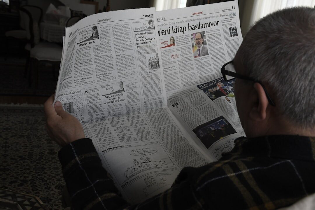 senior reading newspaper