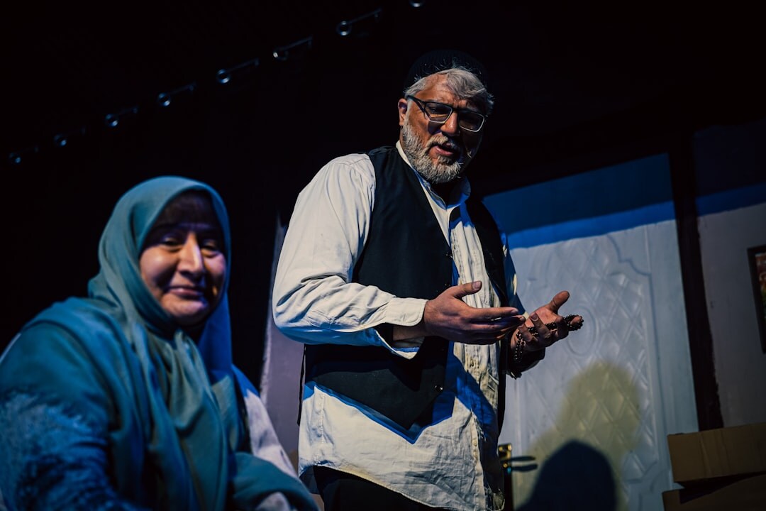 Seniors sitting together in a theatre audience before a performance