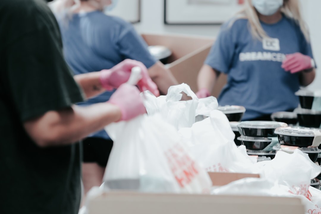 Senior volunteers packing donation boxes together